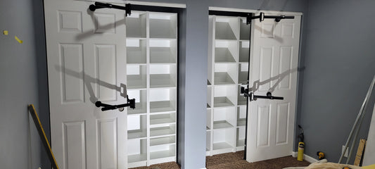 Image of the Clever Closet Rod System installed in a small closet, showcasing rotating rods and multi-level hanging space.